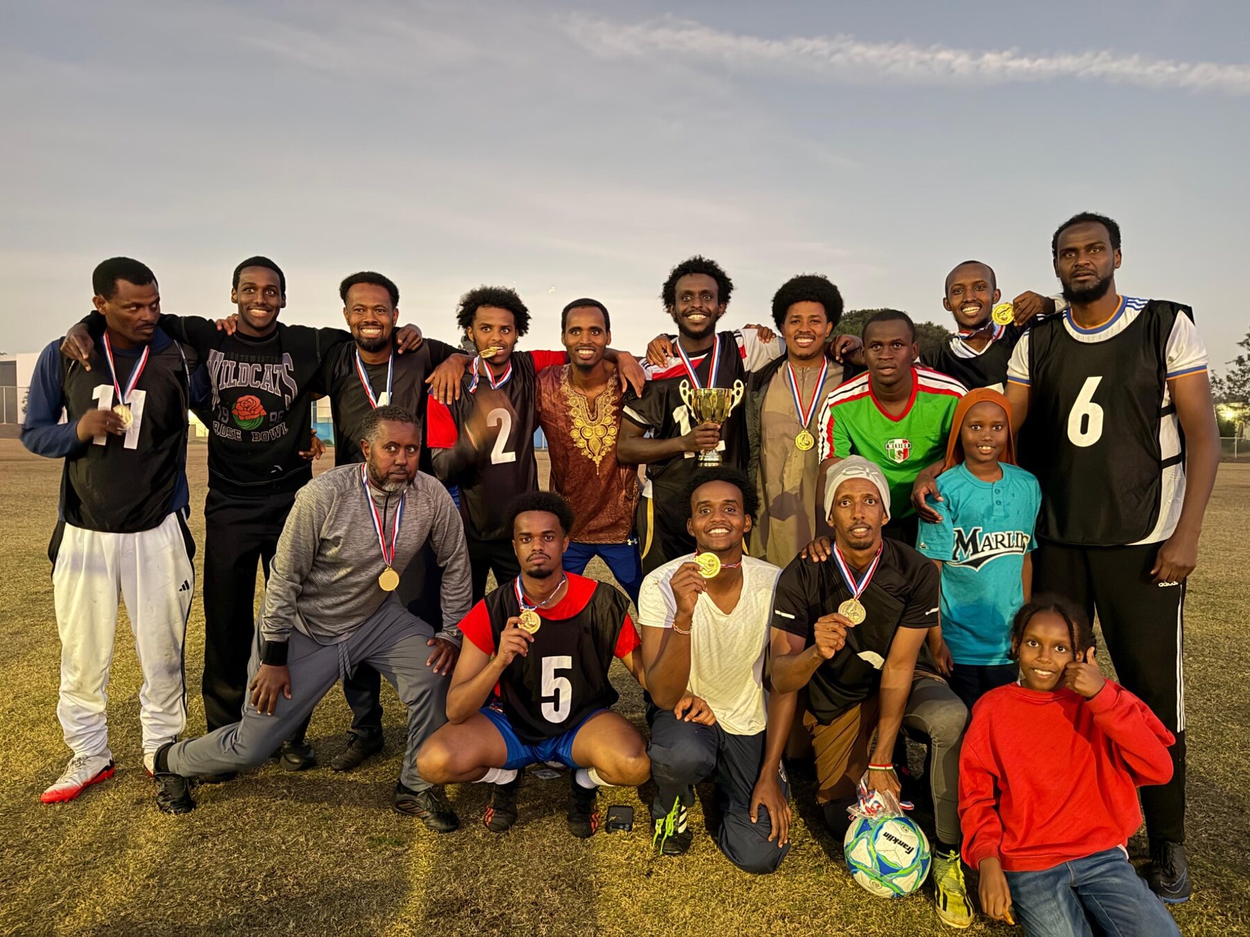 Tournament team celebrating with medals