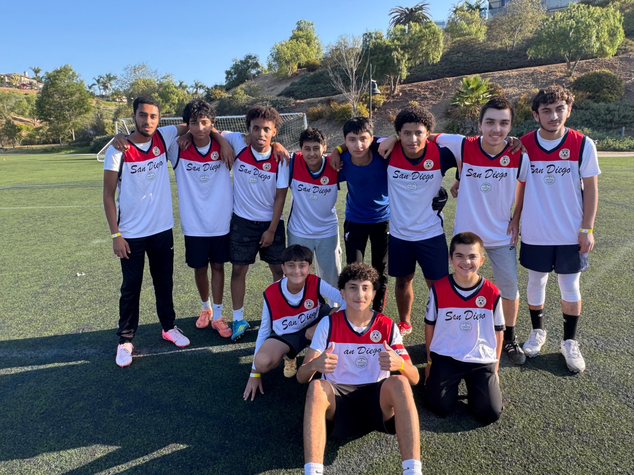 San Diego youth soccer team posing together on the field